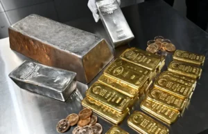 Złoto zyskuje na słabszym dolarze; Rozmowy Iran-USA w centrum uwagi